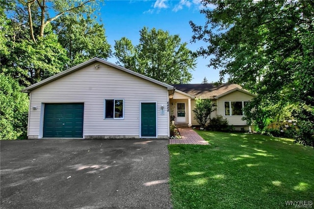 ranch-style home with a garage and a front yard