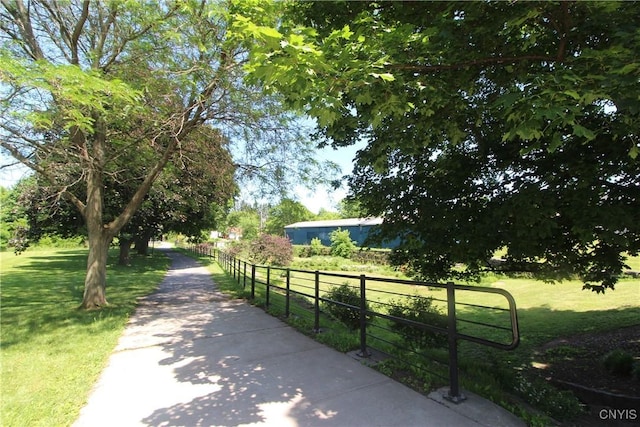 view of property's community with a lawn