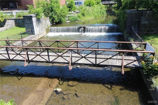 view of swimming pool with a water view