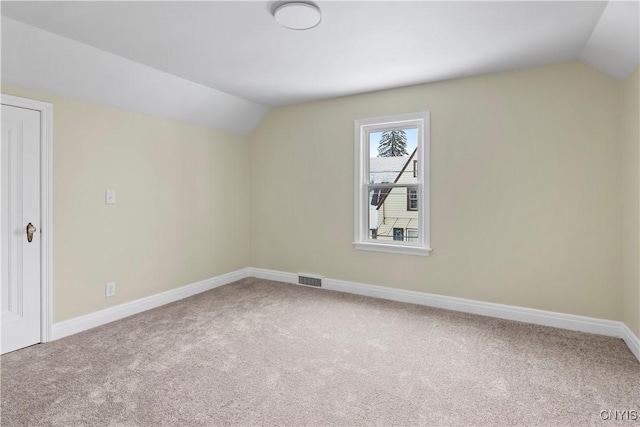 additional living space with lofted ceiling and carpet floors