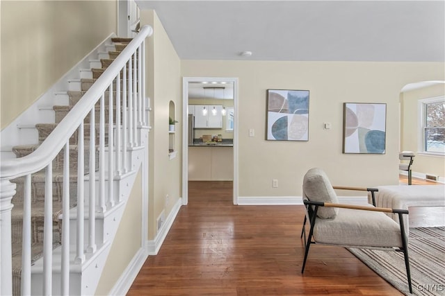 office with dark hardwood / wood-style flooring