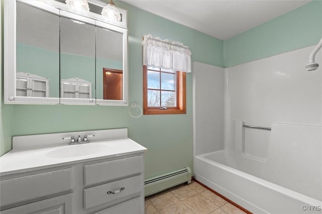 bathroom featuring vanity, tub / shower combination, and a baseboard heating unit