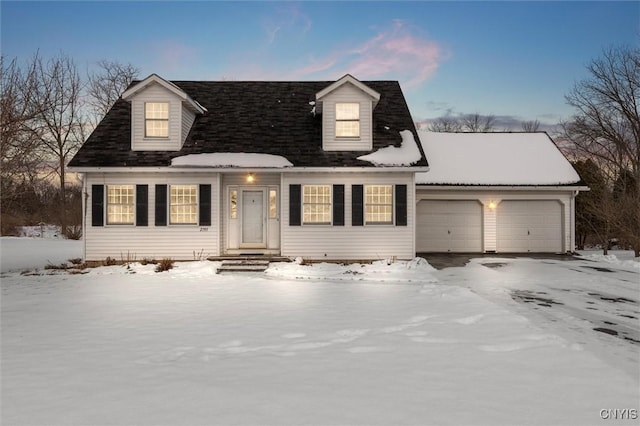 cape cod house featuring a garage