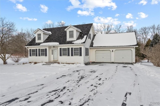 cape cod house featuring a garage