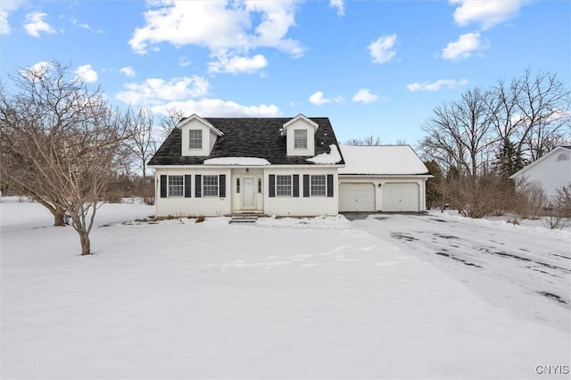 new england style home featuring a garage