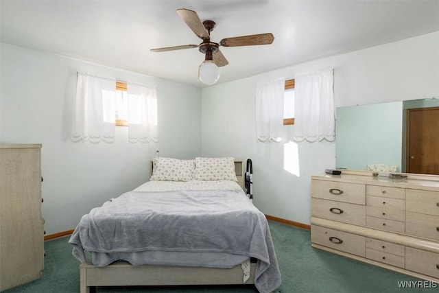 carpeted bedroom with multiple windows and ceiling fan