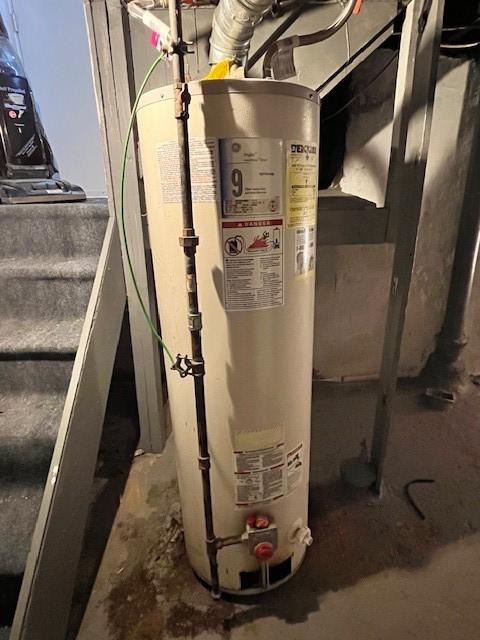 utility room featuring gas water heater