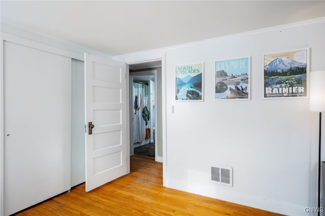 interior space featuring a closet and light hardwood / wood-style flooring