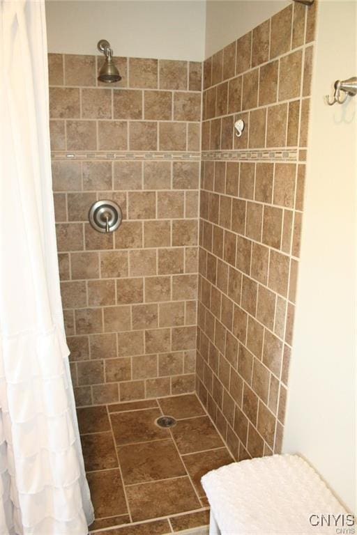 bathroom with a shower with shower curtain