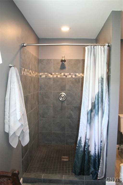 bathroom featuring tile patterned flooring and a shower with curtain