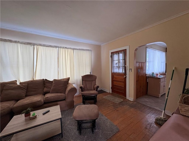 living room featuring hardwood / wood-style flooring and ornamental molding