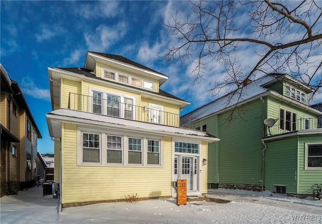 rear view of property with a balcony