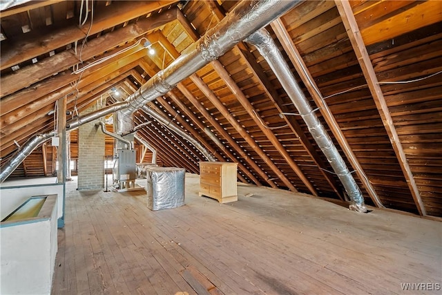 unfinished attic featuring heating unit