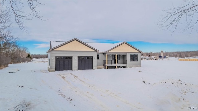 view of front of house featuring a garage and covered porch