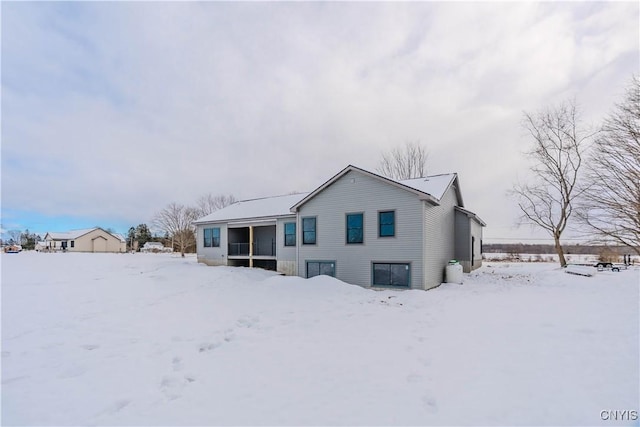 view of snow covered house