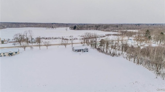 snowy aerial view featuring a rural view