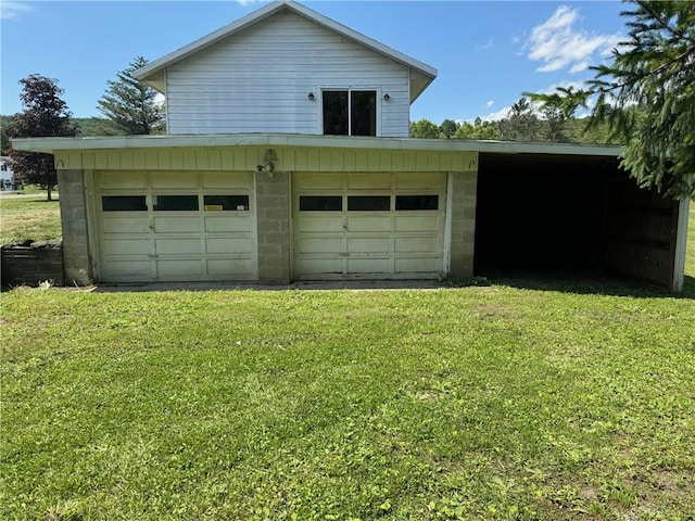 garage with a lawn