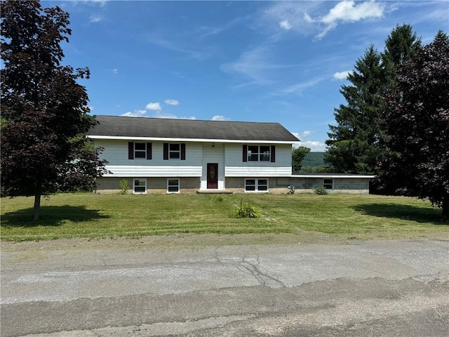 split foyer home with a front lawn