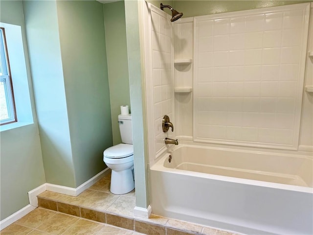 bathroom featuring tile patterned flooring, shower / bath combination, and toilet