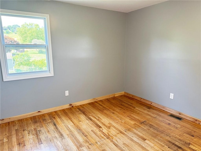 empty room with a healthy amount of sunlight and light wood-type flooring