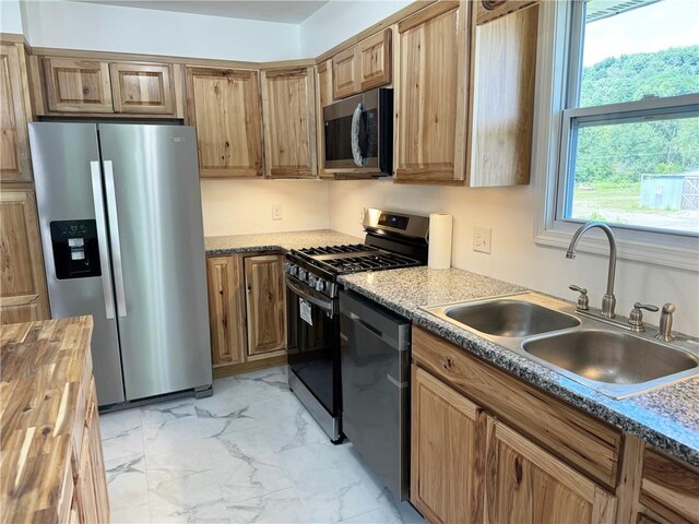 110 Suncrest Terrace Rd, Norwich-Town, NY 13815 - kitchen with appliances with stainless steel finishes, a sink, butcher block counters, and light marble finish floors