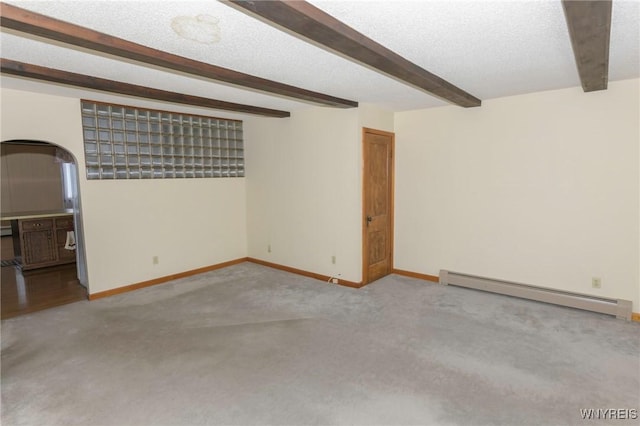 interior space featuring a baseboard heating unit and a textured ceiling