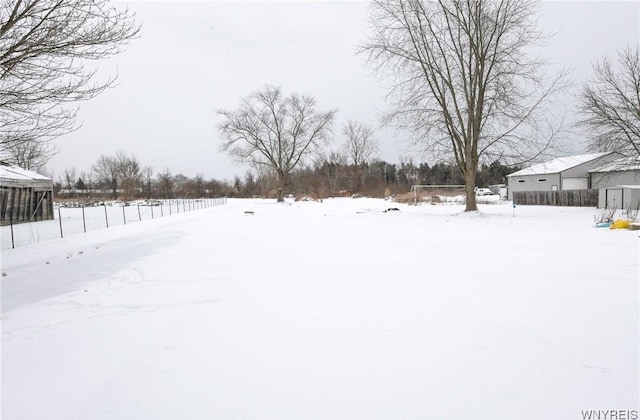 view of yard covered in snow