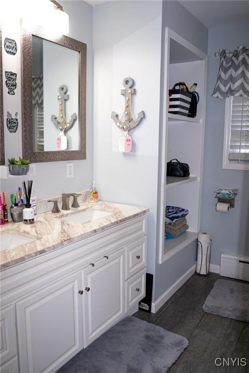 bathroom featuring vanity and a baseboard heating unit