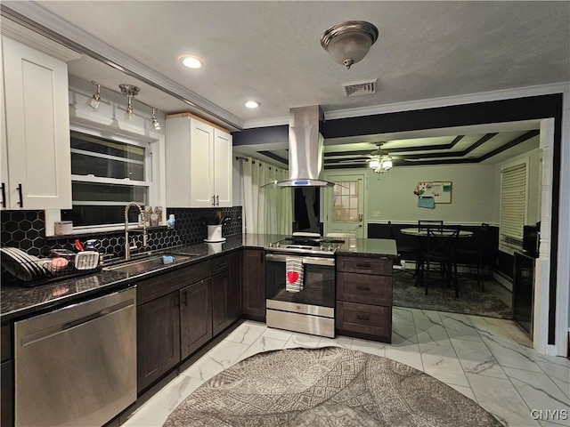 kitchen featuring stainless steel appliances, sink, and white cabinets