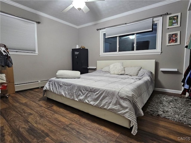 bedroom featuring crown molding, a baseboard heating unit, dark wood-type flooring, and ceiling fan