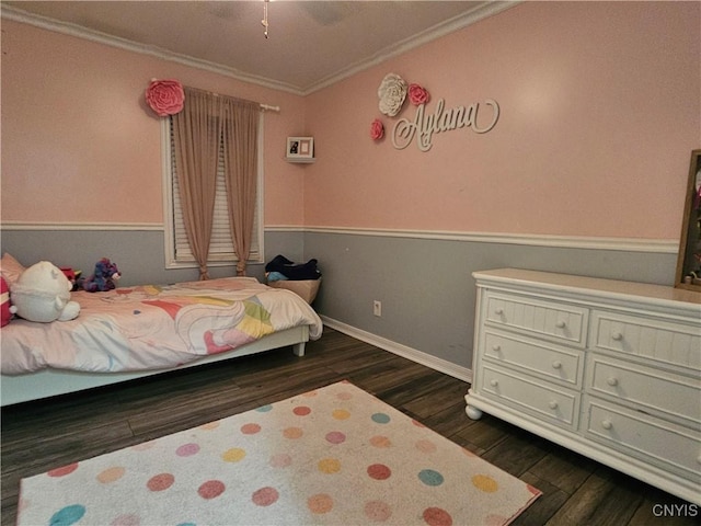 bedroom with ornamental molding and dark hardwood / wood-style flooring