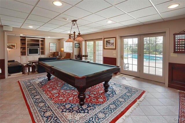 recreation room featuring a drop ceiling, light tile patterned floors, and pool table