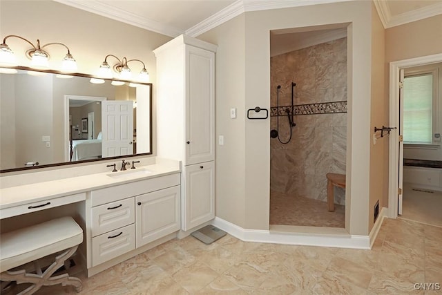 bathroom featuring tiled shower, ornamental molding, and vanity