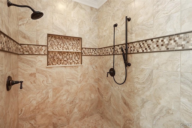 details with ornamental molding and tiled shower