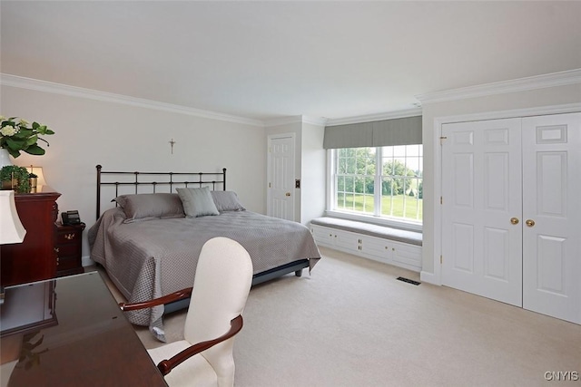 carpeted bedroom with crown molding