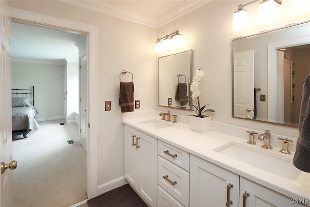 bathroom featuring crown molding and vanity