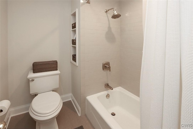 bathroom featuring toilet and shower / tub combo