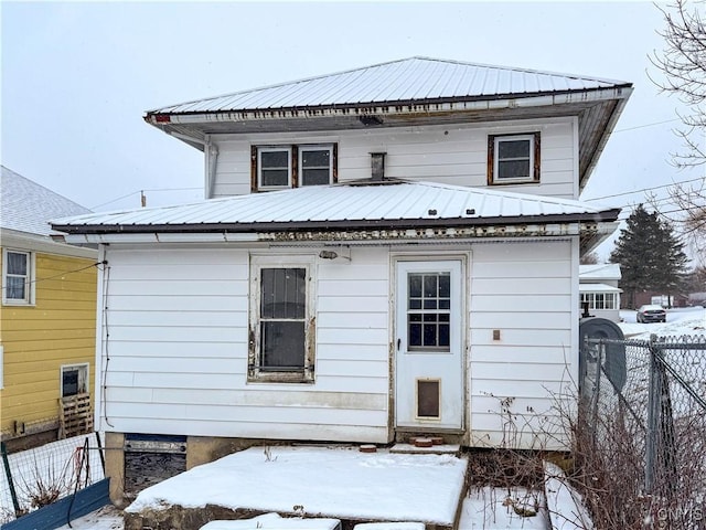 view of snow covered house