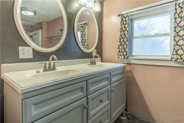 bathroom with vanity and tile patterned flooring