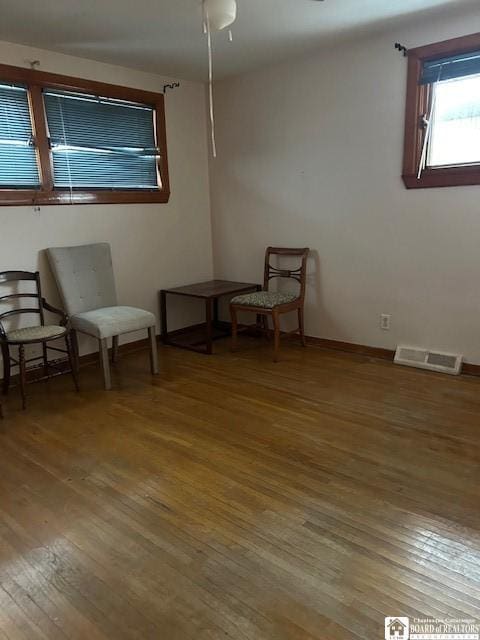 sitting room with hardwood / wood-style floors