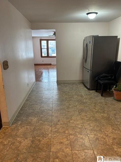 kitchen with stainless steel refrigerator and ceiling fan