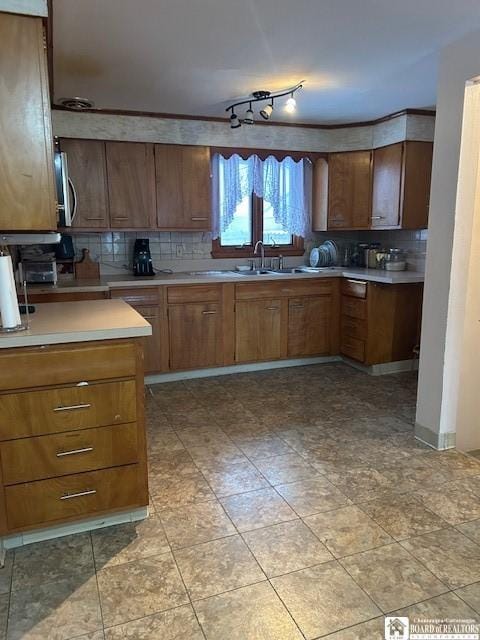 kitchen featuring sink and backsplash