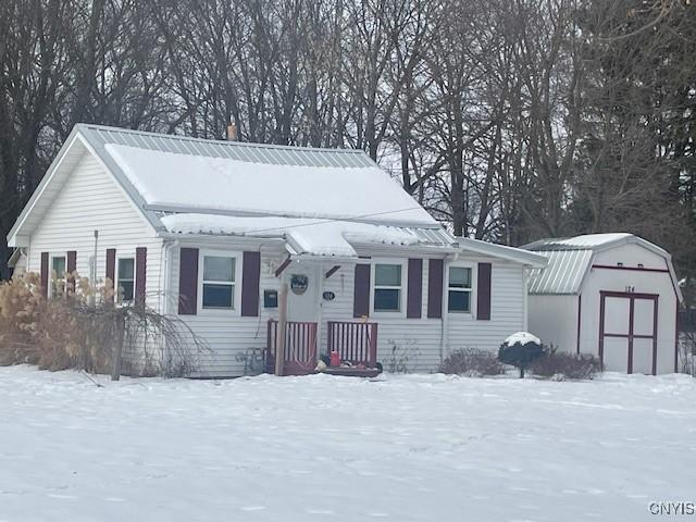 view of front facade featuring a shed