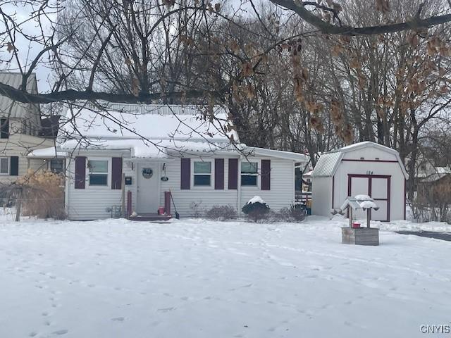 view of front facade with a shed