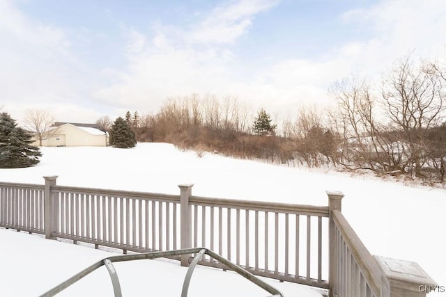 view of snow covered deck