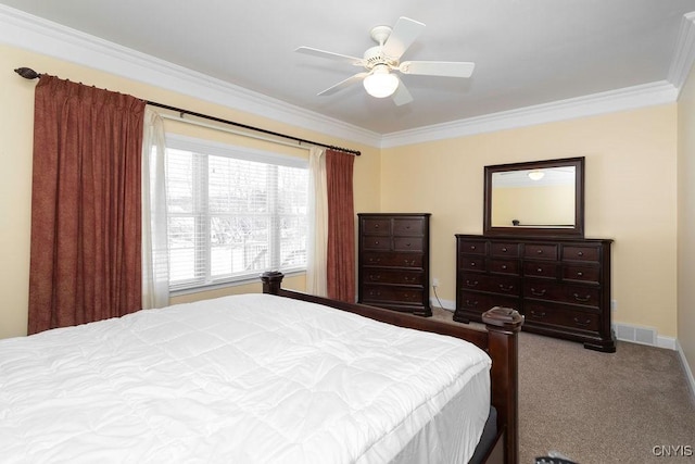 bedroom with ornamental molding, carpet, and ceiling fan