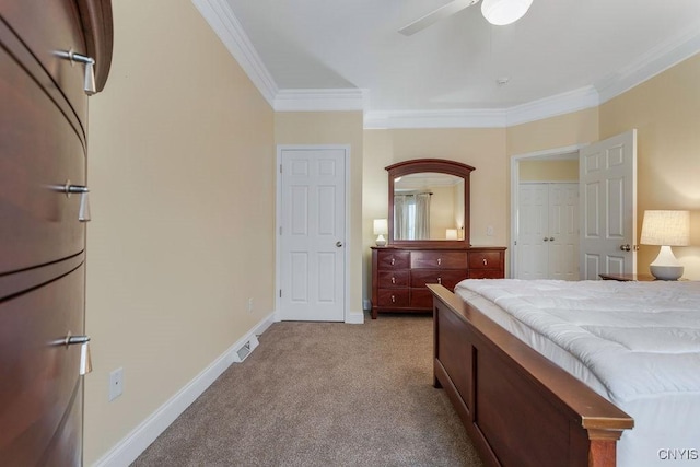 carpeted bedroom with crown molding, ceiling fan, and a closet