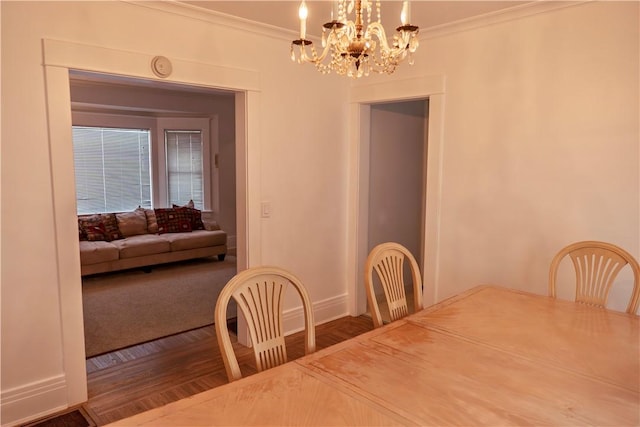 dining area featuring ornamental molding and wood-type flooring