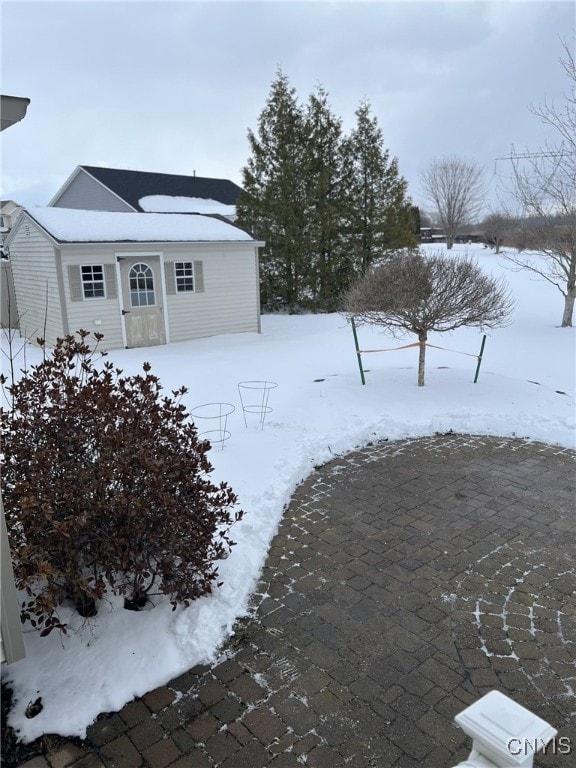 view of yard covered in snow