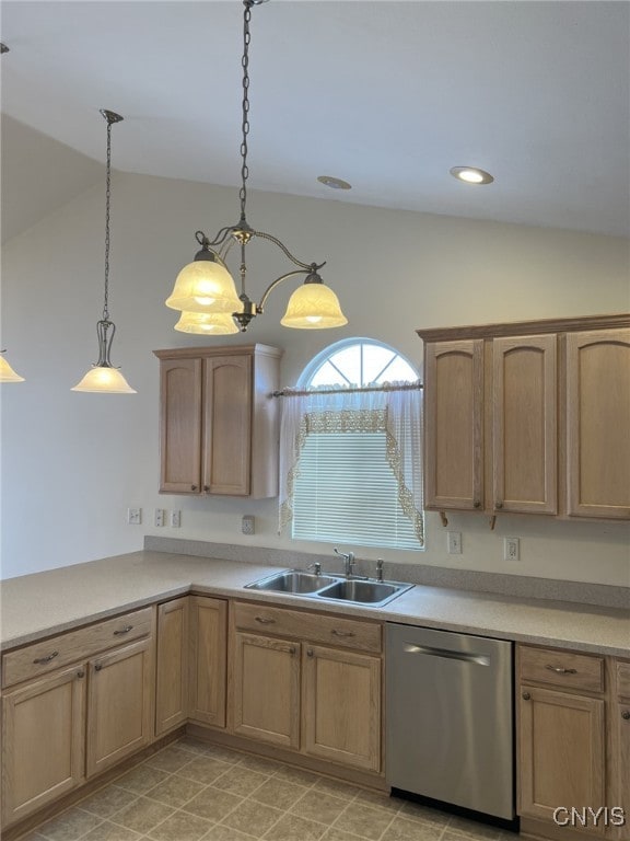 kitchen with pendant lighting, sink, lofted ceiling, and dishwasher